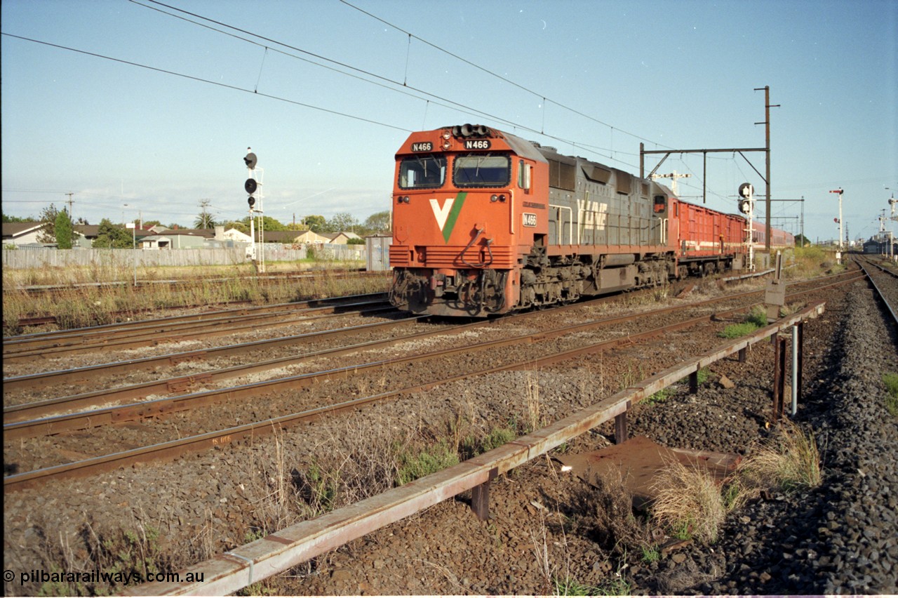 124-06
Sunshine V/Line broad gauge down passenger service with N class N 466 Clyde Engineering EMD model JT22HC-2 serial 86-1195 'City of Warrnambool' and D vans and N set, standard gauge Sunshine Loop up home signal on the far left, Newport Loop Line on the right.
Keywords: N-class;N466;Clyde-Engineering-Somerton-Victoria;EMD;JT22HC-2;86-1195;