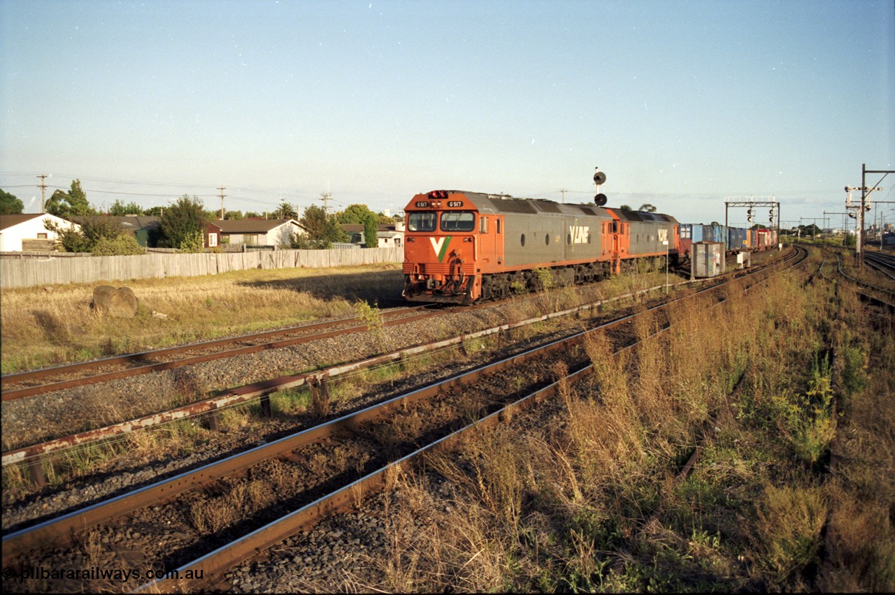 124-12
Sunshine Loop, V/Line standard gauge Sydney bound down goods train with G class G 517 Clyde Engineering EMD model JT26C-2SS serial 85-1230 and another G class
Keywords: G-class;G517;Clyde-Engineering-Rosewater-SA;EMD;JT26C-2SS;85-1230;