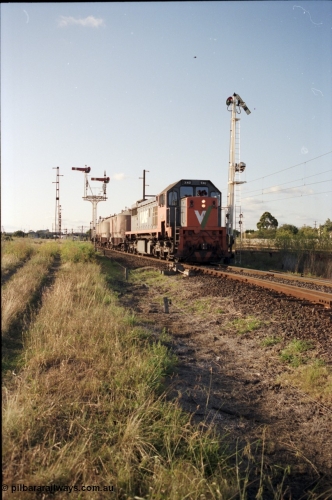 124-10
Sunshine V/Line broad gauge up goods train taking Newport Loop Line with X class X 40 Clyde Engineering EMD model G26C serial 70-703, semaphore signal posts 49 pulled off for movement, semaphore signal post 36 behind train
Keywords: X-class;X40;Clyde-Engineering-Granville-NSW;EMD;G26C;70-703;