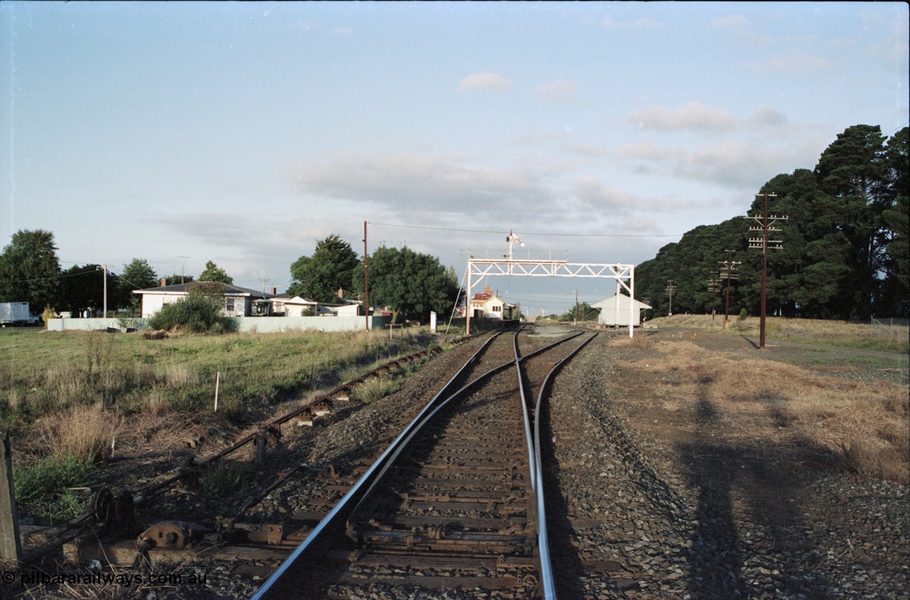 125-02
Ballan station overview, looking toward Melbourne from up end points, signal gantry, road set for down pass.
