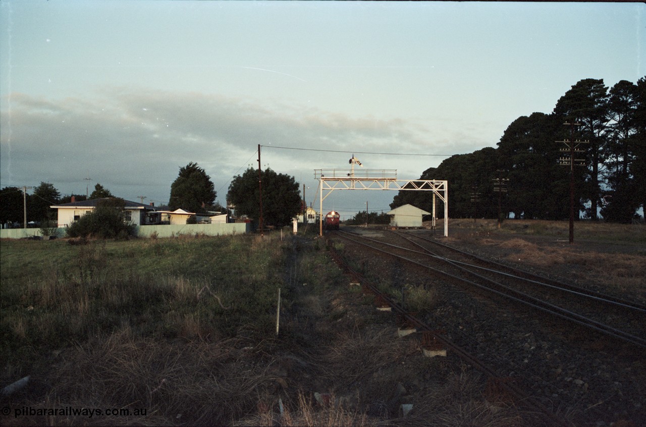 125-03
Ballan station overview, signal gantry, goods shed, broad gauge V/Line N class N 474 Clyde Engineering EMD model JT22HC-2 serial 87-1203 'City of Traralgon' with down pass, distant shot.
Keywords: N-class;N474;Clyde-Engineering-Somerton-Victoria;EMD;JT22HC-2;87-1203;