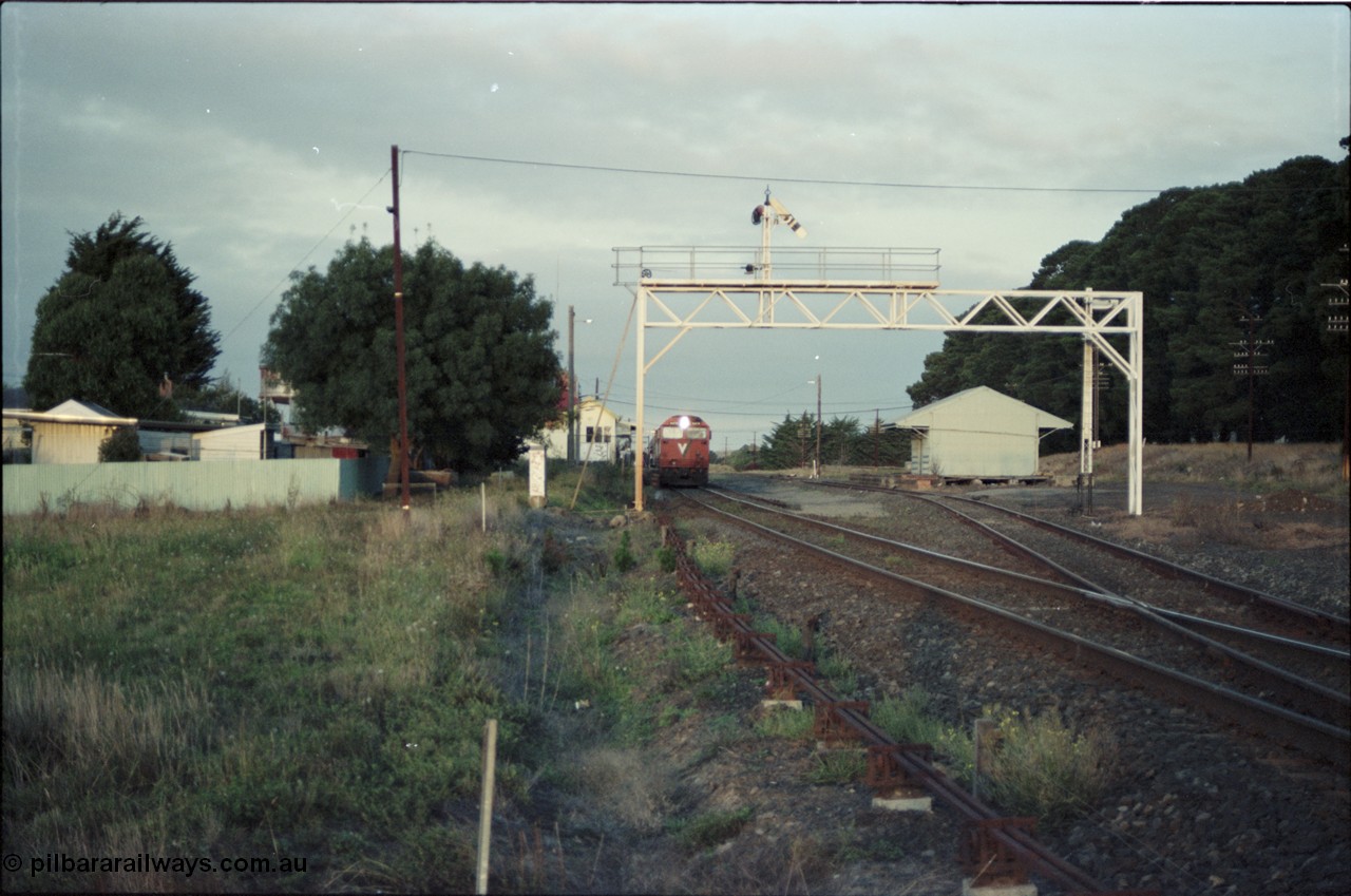 125-04
Ballan station overview, signal gantry, goods shed, V/Line broad gauge N class Clyde Engineering EMD model JT22HC-2 serial 87-1203 'City of Traralgon' with down pass.
Keywords: N-class;N474;Clyde-Engineering-Somerton-Victoria;EMD;JT22HC-2;87-1203;