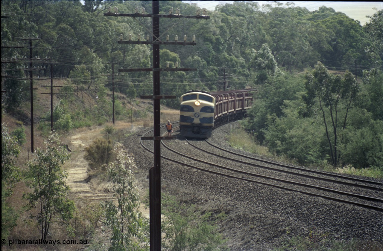 125-13
Kilmore East V/Line broad gauge B class 65 Clyde Engineering EMD model ML2 serial ML2-6 still in Victorian Railways livery leads a sleeper discharge train on the up broad gauge line, ganger walking line.
Keywords: B-class;B65;Clyde-Engineering-Granville-NSW;EMD;ML2;ML2-6;bulldog;