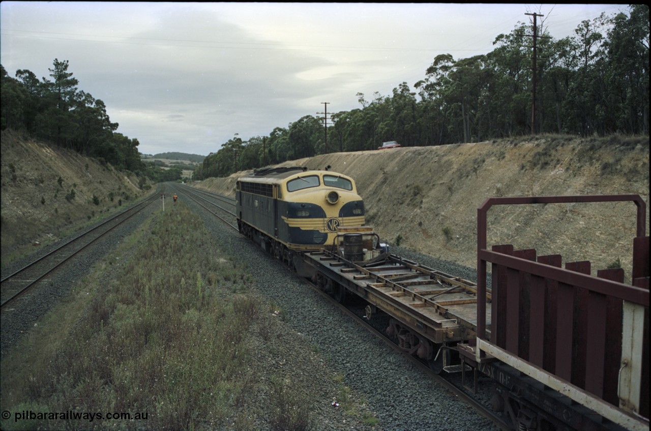 125-21
Heathcote Junction, V/Line broad gauge B class Clyde Engineering EMD model ML2 serial ML2-6 still in Victorian Railways livery leads a sleeper discharge train on the up broad gauge line, rolling down toward Wallan, V/Line VZCA class waggon.
Keywords: B-class;B65;Clyde-Engineering-Granville-NSW;EMD;ML2;ML2-6;bulldog;