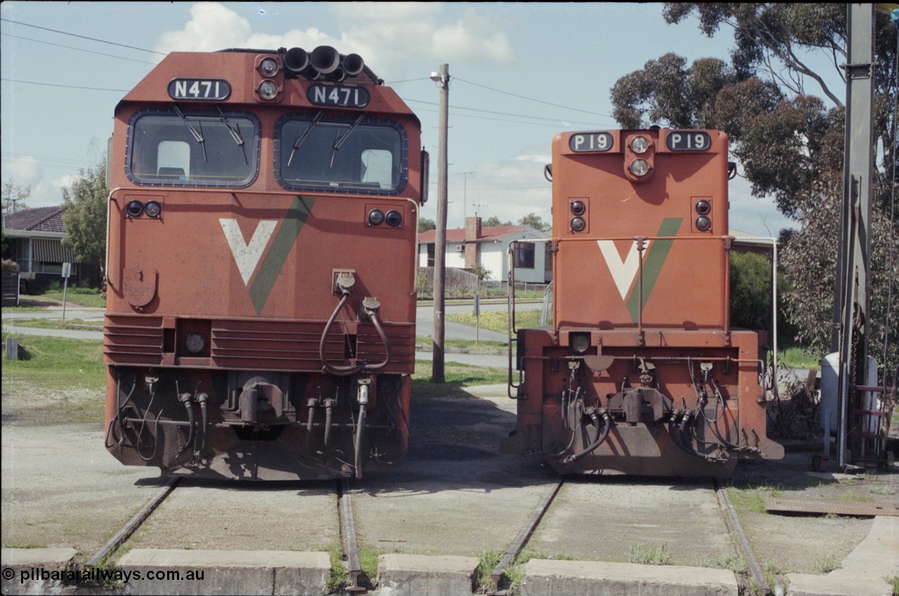 126-35
Seymour loco depot turntable roads, broad gauge V/Line passenger power large and small in the form of Clyde Engineering EMD models JT22HC-2 N class N 471 serial 87-1200 (2480 hp) and G18HBR P class P 19 serial 84-1212 (1100 hp), front view.
Keywords: N-class;N471;Clyde-Engineering-Somerton-Victoria;EMD;JT22HC-2;87-1200;P-class;P19;G18HBR;84-1212;rebuild;