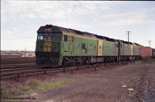 126-03
Tottenham yard, broad gauge Australian National BL class locos BL 29 Clyde Engineering EMD model JT26C-2SS serial 83-1013 and BL 31 serial 83-1015 lead up Adelaide goods train 9150 into Tottenham yard, taken from standard gauge line.
Keywords: BL-class;BL29;Clyde-Engineering-Rosewater-SA;EMD;JT26C-2SS;83-1013;