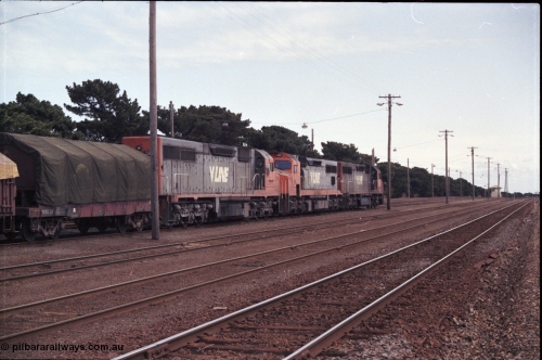 126-06
Tottenham broad gauge train 9169 down goods to Adelaide via Cressy, brake testing at Tottenham 9.5 km, V/Line C classes C 503 Clyde Engineering EMD model GT26C serial 76-826, C 506 serial 76-829 and C 501 'George Brown' serial 76-824, trailing view.
Keywords: C-class;C501;Clyde-Engineering-Rosewater-SA;EMD;GT26C;76-824;C506;76-826;C503;76-829;