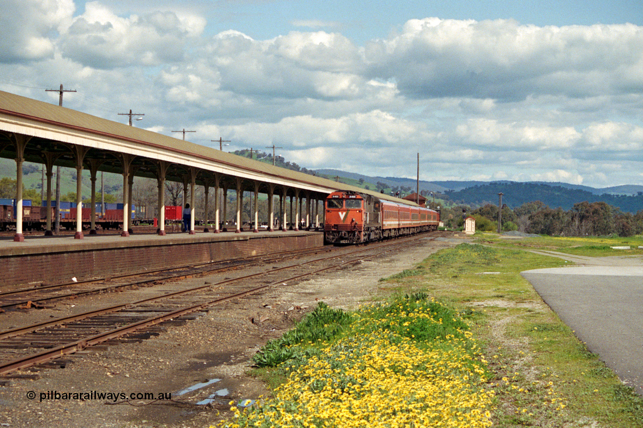 127-05
Albury, broad gauge passenger platform, V/Line N class N 468 'City of Bairnsdale' Clyde Engineering EMD model JT22HC-2 serial 86-1197 arriving with a down empty carriage set to form the afternoon up passenger train, double N set.
Keywords: N-class;N468;Clyde-Engineering-Somerton-Victoria;EMD;JT22HC-2;86-1197;