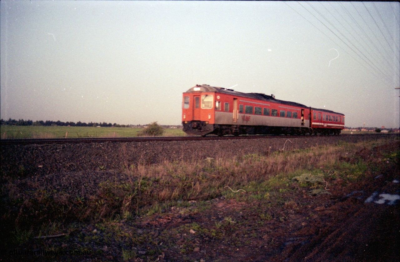 127-16
Deer Park West, V/Line broad gauge Tulloch Ltd DRC class diesel rail car and MTH class trailer hurry with a down passenger train.
Keywords: DRC-class;Tulloch-Ltd-NSW;