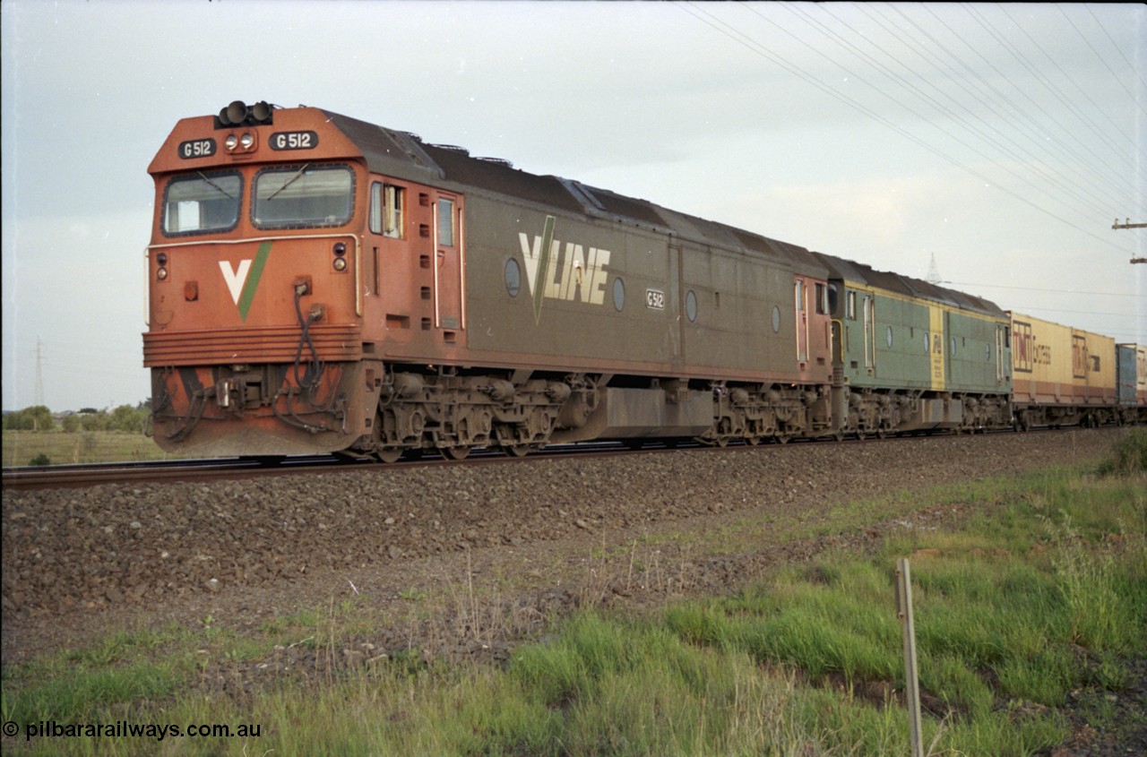 127-23
Deer Park West, broad gauge V/Line G class G 512 Clyde Engineering EMD model JT26C-2SS serial 84-1240 leads Australian National BL class BL 27 Clyde Engineering EMD model JT26C-2SS serial 83-1011 with a down Adelaide bound goods train waiting for line clear at the end of the double track.
Keywords: G-class;G512;Clyde-Engineering-Rosewater-SA;EMD;JT26C-2SS;84-1240;