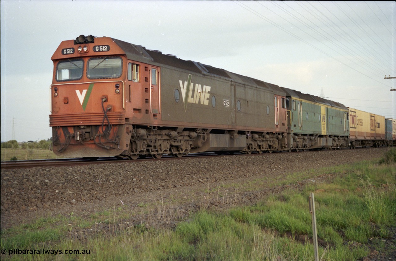 127-23
Deer Park West, broad gauge V/Line G class G 512 Clyde Engineering EMD model JT26C-2SS serial 84-1240 leads Australian National BL class BL 27 Clyde Engineering EMD model JT26C-2SS serial 83-1011 with a down Adelaide bound goods train waiting for line clear at the end of the double track.
Keywords: G-class;G512;Clyde-Engineering-Rosewater-SA;EMD;JT26C-2SS;84-1240;