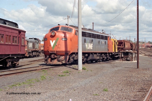 127-04
Seymour loco depot, V/Line B class B 61 Clyde Engineering EMD model ML2 serial ML2-2, Rail Tractor RT class member RT 40 and ballast waggons in view.
Keywords: B-class;B61;Clyde-Engineering-Granville-NSW;EMD;ML2;ML2-2;bulldog;