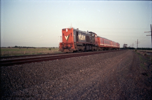 127-15
Deer Park West, V/Line broad gauge P class P 19 Clyde Engineering EMD model G18HBR serial 84-1212 rebuilt from T 331 Clyde Engineering EMD model G8B serial 56-98 with H set, down early evening Bacchus Marsh passenger service, note mismatched panel doors on hood of loco.
Keywords: P-class;P19;Clyde-Engineering-Somerton-Victoria;EMD;G18HBR;84-1212;rebuild;