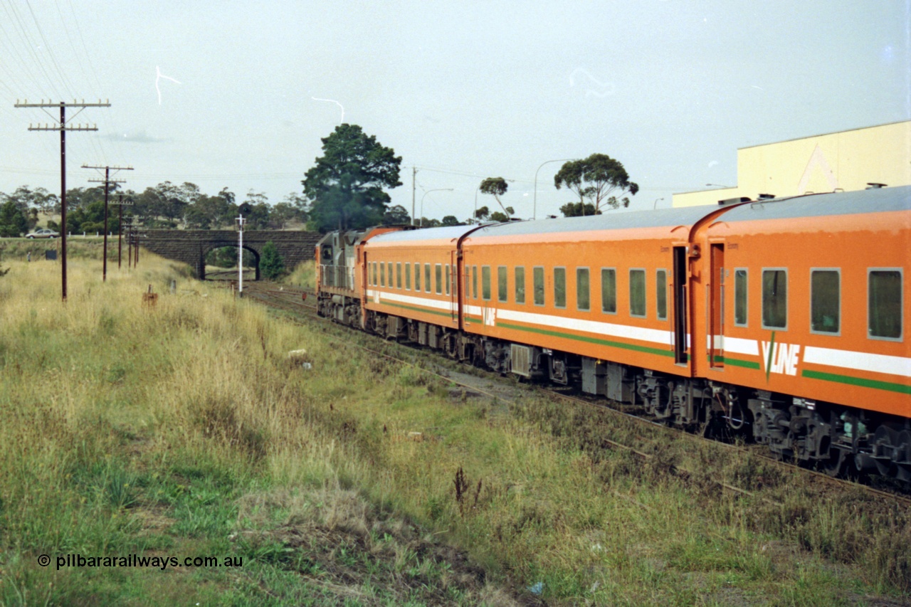 128-24
Sunbury, V/Line broad gauge N class N 461 'City of Ararat' Clyde Engineering EMD model JT22HC-2 serial 86-1190, N set, down passenger train departing, trailing view.
Keywords: N-class;N461;Clyde-Engineering-Somerton-Victoria;EMD;JT22HC-2;86-1190;