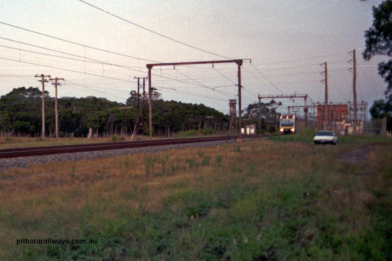 129-1-05
Nar Nar Goon - Tynong section, west of Tynong, 4D (Double Deck Development and Demonstration), double deck suburban electric set, testing phase. The set was built by Goninan NSW in December 1991 as a 'Tamgara' model.
Keywords: 4D;Double-Deck-Development-Demonstration-train;Goninan-NSW;Tangara;