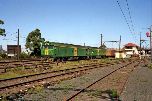 129-1-08
Sunshine, Australian National BL classes BL 33 Clyde Engineering EMD model JT26C-2SS serial 83-1017 and BL 32 serial 83-1016 in AN livery, lead a broad gauge down Adelaide goods train along No.2 Rd onto the South Line, signal box, points and point rodding, Sunshine still mechanically interlocked.
Keywords: BL-class;BL33;Clyde-Engineering-Rosewater-SA;EMD;JT26C-2SS;83-1017;
