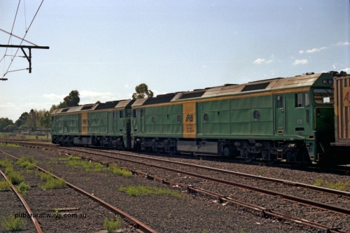 129-1-09
Sunshine, Australian National BL classes BL 33 Clyde Engineering EMD model JT26C-2SS serial 83-1017 and BL 32 serial 83-1016 in AN livery, lead a broad gauge down Adelaide goods train along No.2 Rd onto the South Line, point rodding, trailing view.
Keywords: BL-class;BL32;Clyde-Engineering-Rosewater-SA;EMD;JT26C-2SS;83-1016;