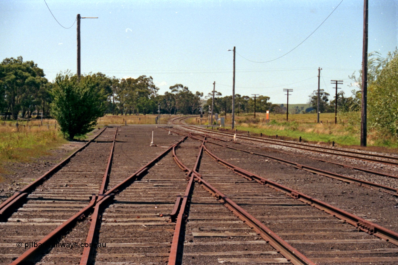 129-2-15
Nyora yard view, old stock yard on left, looking down direction east across Poowong Road towards Korumburra.
