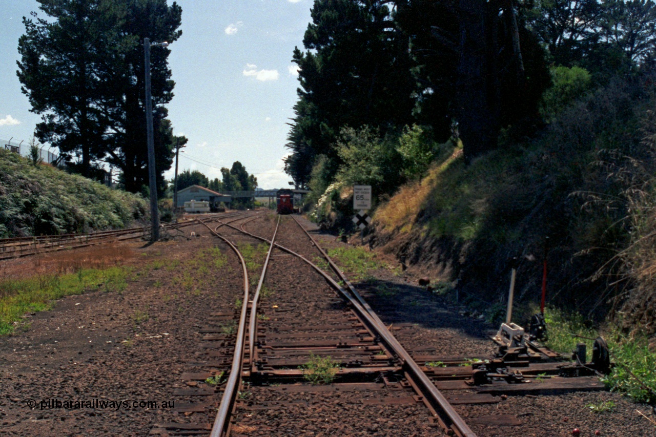 129-2-25
Leongatha station overview, looking towards Melbourne from west end, points and point and signal levers with interlocking, stabled broad gauge V/Line passenger train at platform, P class P 11 Clyde Engineering EMD model G18HBR serial 84-1205 rebuilt from T 336 Clyde Engineering EMD model G8B serial 56-110 and H set.
