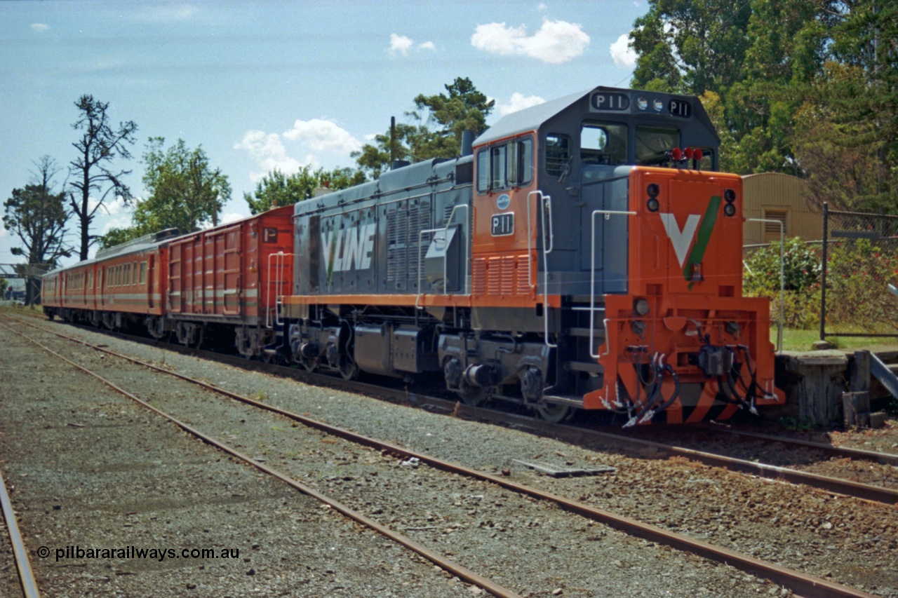 129-2-26
Leongatha V/Line P class P 11 Clyde Engineering EMD model G18HBR serial 84-1205 rebuilt from T 336 Clyde Engineering EMD model G8B serial 56-110, and H set, stabled pass.
Keywords: P-class;P11;Clyde-Engineering-Somerton-Victoria;EMD;G18HBR;84-1205;rebuild;