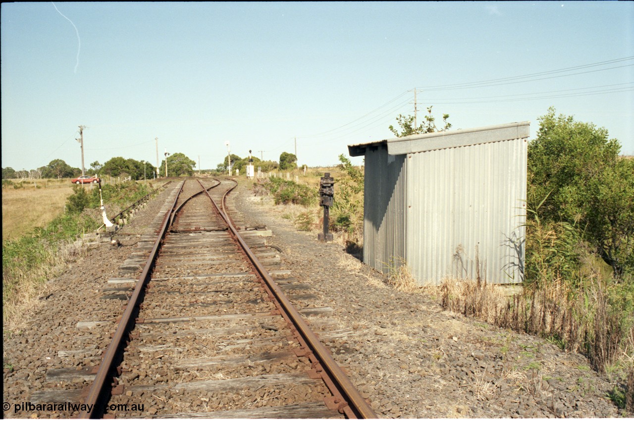 129-3-12
Barry Beach Junction track overview, junction points, Welshpool - Yarram line is main, line to Barry Beach and ESSO complex on the right, redundant staff lock opposite points and lever.
