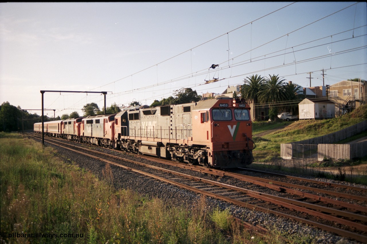 129-3-18
Warragul broad gauge V/Line down pass N class N 453 'City of Albury' Clyde Engineering EMD model JT22HC-2 serial 85-1221, A classes A 62 Clyde Engineering EMD model AAT22C-2R serial 84-1183 rebuilt from B 62 Clyde Engineering EMD model ML2 serial ML2-3 and A 66 serial 84-1186 rebuilt from B 66 serial ML2-7, N set .
Keywords: N-class;N453;Clyde-Engineering-Somerton-Victoria;EMD;JT22HC-2;85-1221;