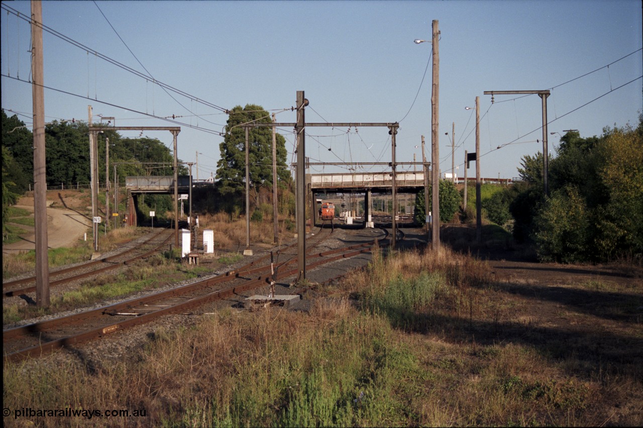 129-3-20
Warragul broad gauge V/Line up passenger train with N class N 461 'City of Ararat' Clyde Engineering EMD model JT22HC-2 serial 86-1190, track view, looking towards station, site of former A signal box, points and point lever, down line on the left.
