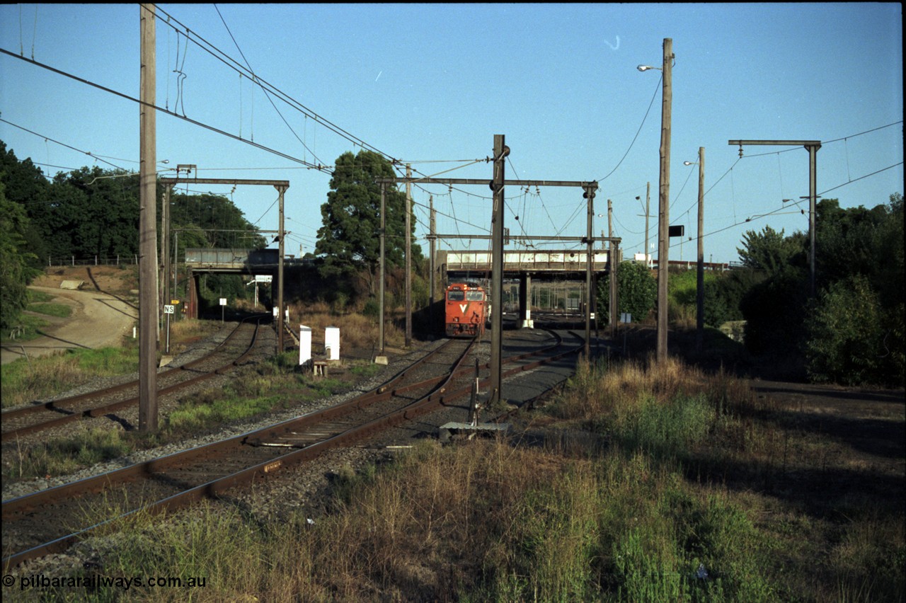 129-3-21
Warragul broad gauge V/Line up passenger train with N class N 461 'City of Ararat' Clyde Engineering EMD model JT22HC-2 serial 86-1190, track view, looking towards station, site of former A signal box, points and point lever, down line on the left.
Keywords: N-class;N461;Clyde-Engineering-Somerton-Victoria;EMD;JT22HC-2;86-1190;