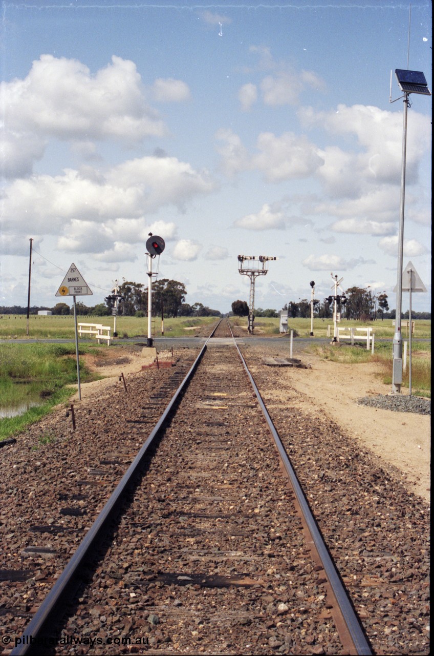 131-1-11
Barnes, track view, looking south, searchlight and semaphore signals, location sign.
