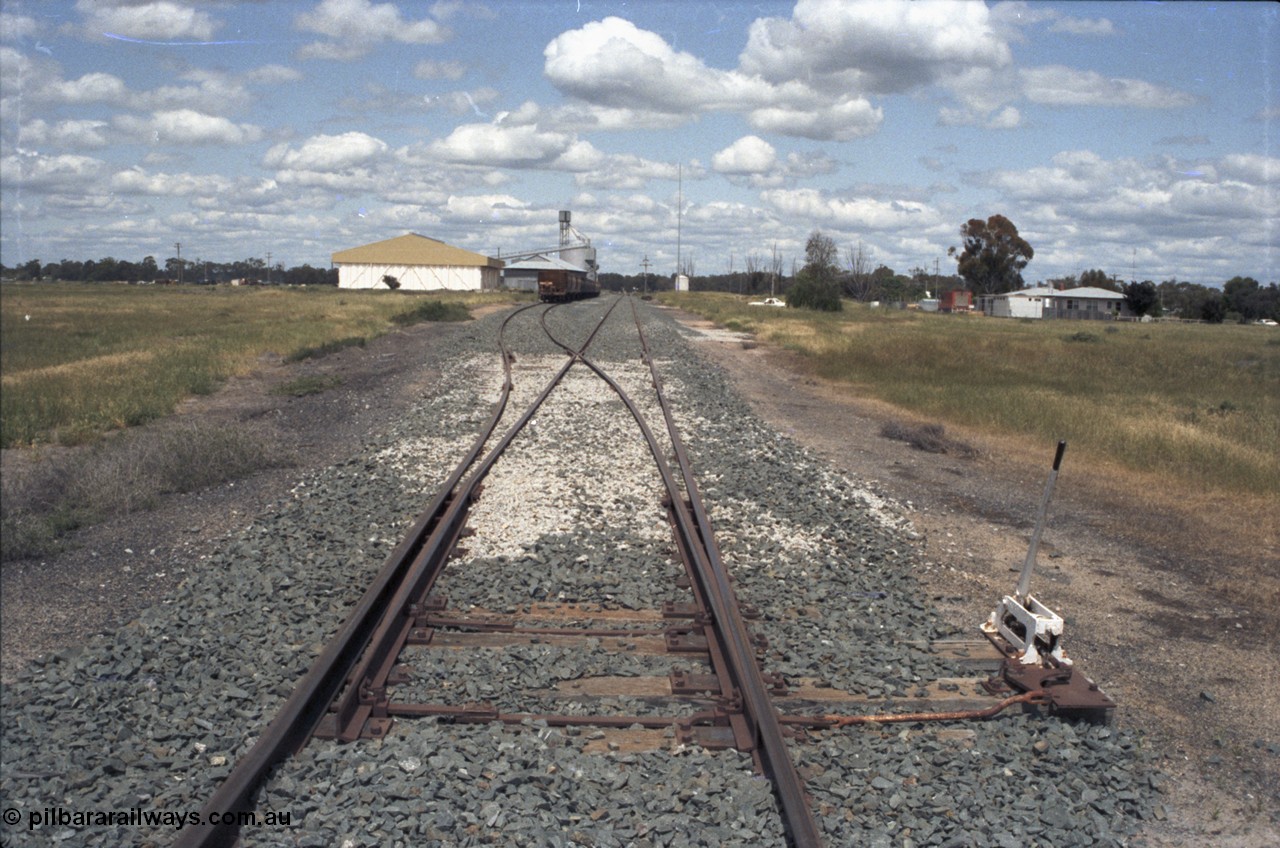 131-2-07
Moulamein yard overview, rice storage and Ascom silo complex, grain waggons, points and point lever.
