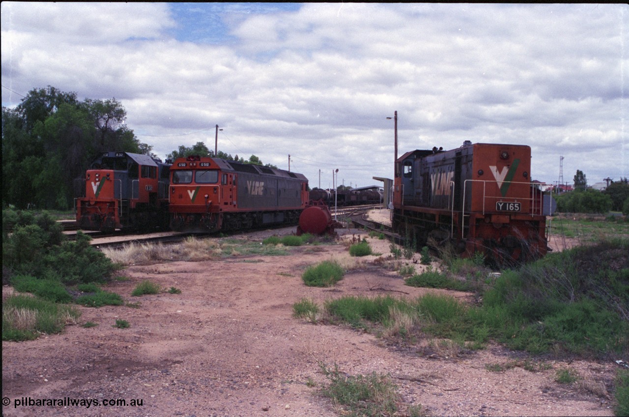 132-18
Mildura loco depot overview looking south, V/Line broad gauge locos X class X 32 Clyde Engineering EMD model G16C serial 66-485, G class G 512 Clyde Engineering EMD model JT26C-2SS serial 84-1240 and Y class Y 165 Clyde Engineering EMD model G6B serial 68-585 on the pit road.
Keywords: Y-class;Y165;Clyde-Engineering-Granville-NSW;EMD;G6B;68-585