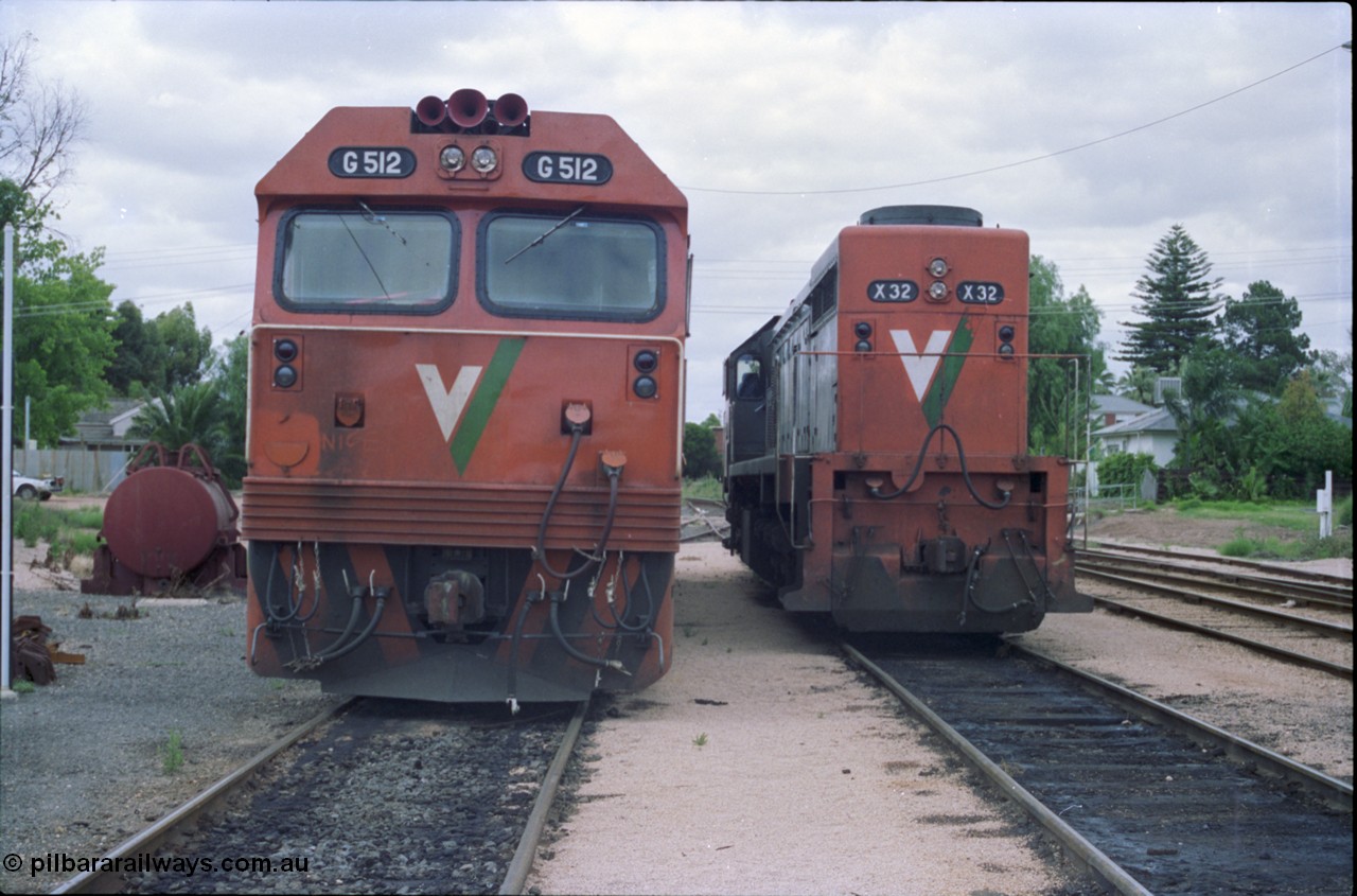 132-24
Mildura loco depot V/Line broad gauge X class X 32 Clyde Engineering EMD model G16C serial 66-485 and G class G 512 Clyde Engineering EMD model JT26C-2SS serial 84-1240, front view.
Keywords: G-class;G512;Clyde-Engineering-Rosewater-SA;EMD;JT26C-2SS;84-1240;X-class;X32;G16C;66-485;