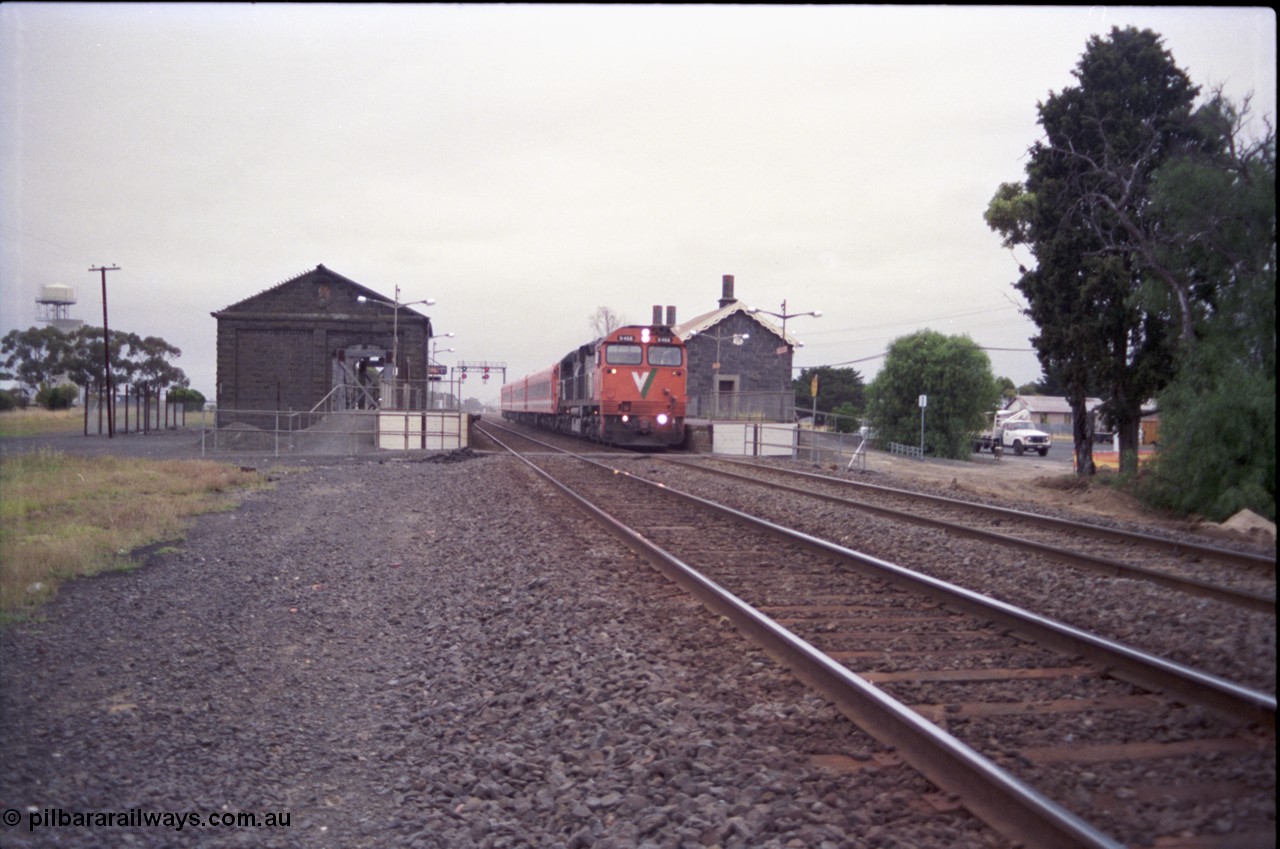 133-06
Little River, V/Line broad gauge N class N 466 'City of Warrnambool' Clyde Engineering EMD model JT22HC-2 serial 86-1195 with down Geelong passenger train 8219, station overview, bluestone buildings.
Keywords: N-class;N466;Clyde-Engineering-Somerton-Victoria;EMD;JT22HC-2;86-1195;