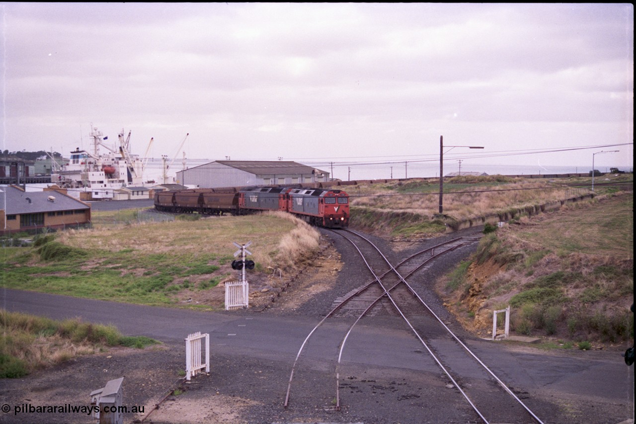 133-08
North Geelong grain loop, empty train being worked back to North Geelong C by V/Line broad gauge G class locos G 528 Clyde Engineering EMD model JT26C-2SS serial 88-1258 and G 524 serial 86-1237, grain train, taken from Corio Quay Rd, diamond crossing.
Keywords: G-class;G528;Clyde-Engineering-Somerton-Victoria;EMD;JT26C-2SS;88-1258;
