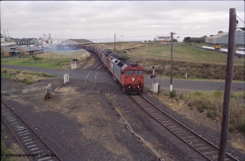 133-09
North Geelong grain loop, empty train being worked back to North Geelong C by V/Line broad gauge G class locos G 528 Clyde Engineering EMD model JT26C-2SS serial 88-1258 and G 524 serial 86-1237, grain train, taken from Corio Quay Rd, track removed, point rodding.
Keywords: G-class;G528;Clyde-Engineering-Somerton-Victoria;EMD;JT26C-2SS;88-1258;
