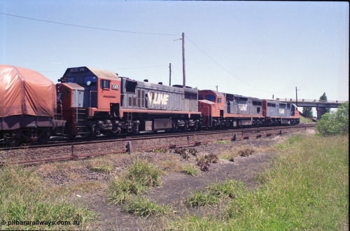 133-28
Gheringhap, V/Line broad gauge locos C class leader C 501 'George Brown' Clyde Engineering EMD model GT26C serial 76-824 leads C 506 serial 76-829 and X class X 45 'Edgar H Brownbill' Clyde Engineering EMD model G26C serial 75-792 with train 9169 down Adelaide goods, on the Cressy line, trailing loco view.
Keywords: X-class;X45;Clyde-Engineering-Rosewater-SA;EMD;G26C;75-792;
