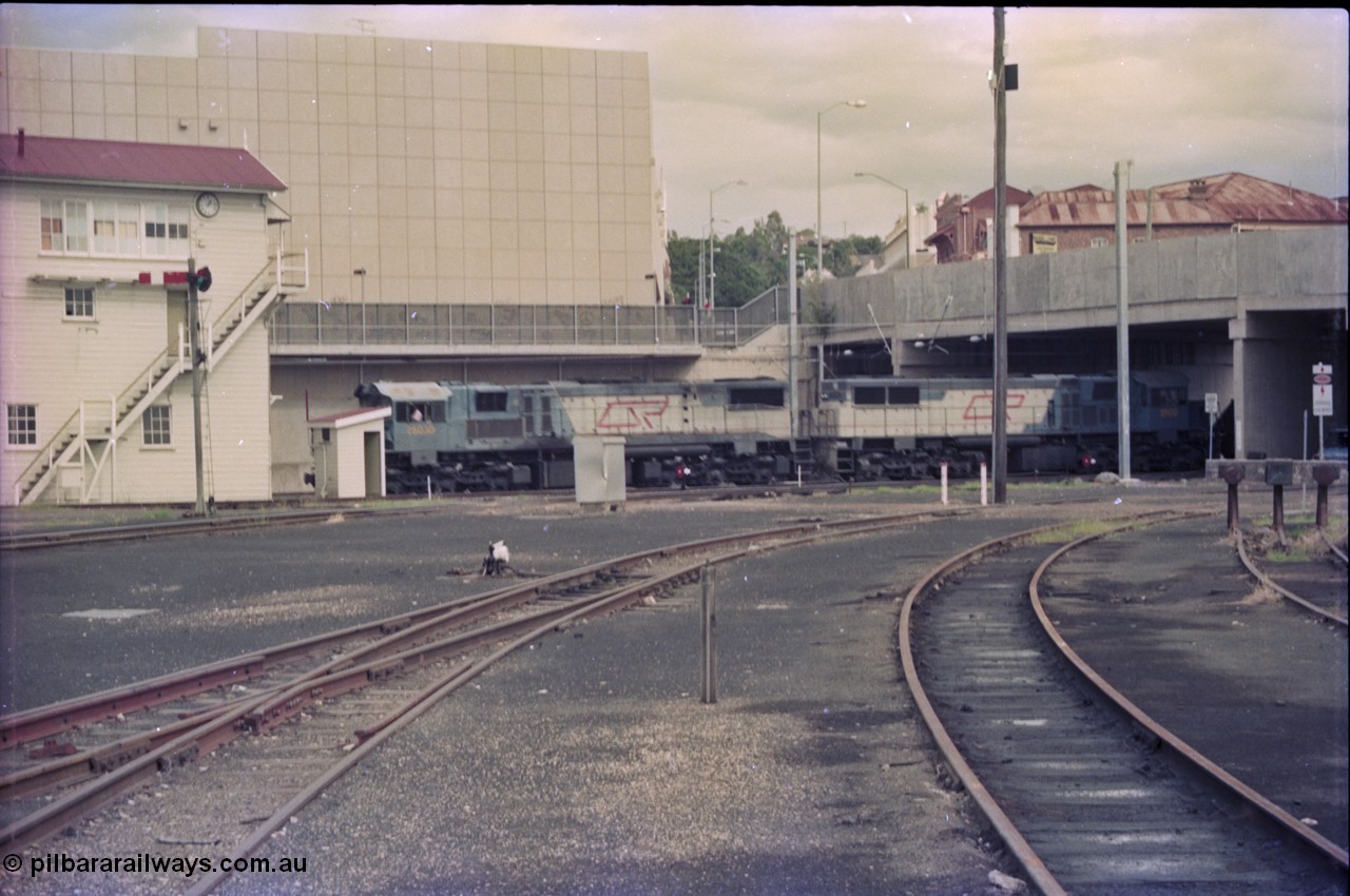 135-02
Loaded coal train sneaks past Ipswich signal box behind QR 2400 class units 2503 and 2500.
