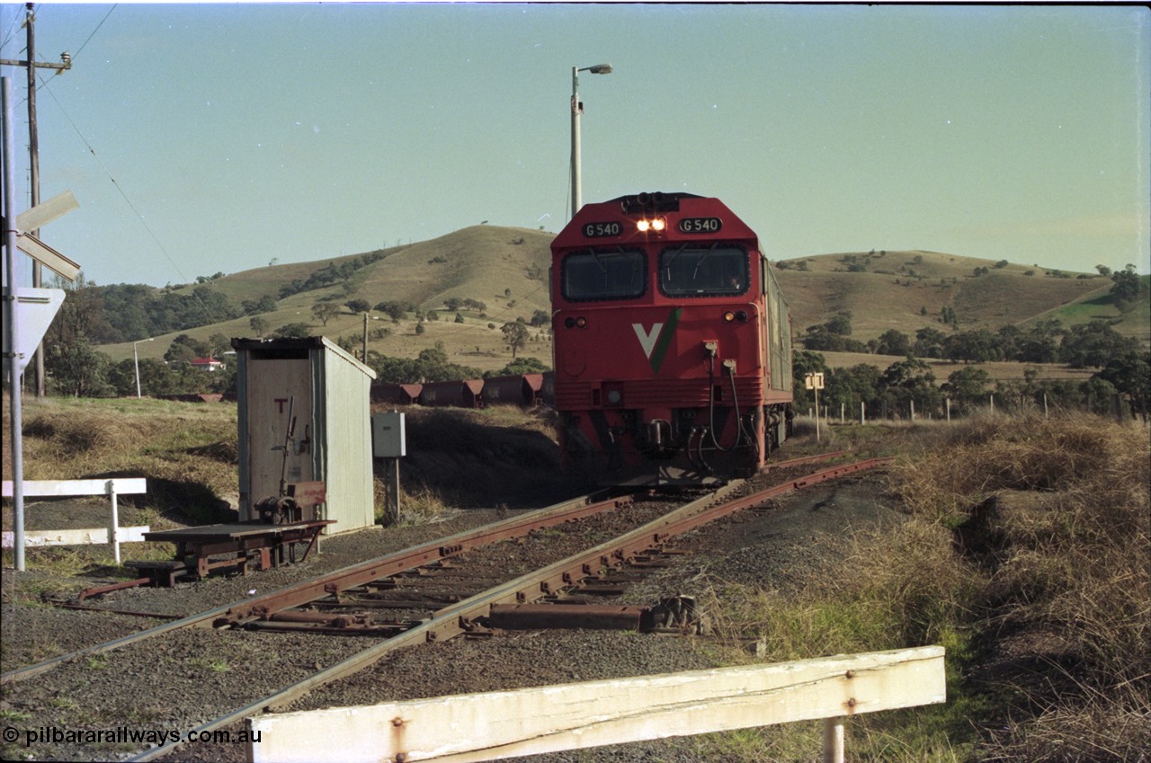 135-14
Kilmore East Apex Quarry siding, V/Line broad gauge G class G 540 Clyde Engineering EMD model JT26C-2SS serial 89-1273 empty train 9315 climbing into siding, points, telephone cabin, point lever.
Keywords: G-class;G540;Clyde-Engineering-Somerton-Victoria;EMD;JT26C-2SS;89-1273;