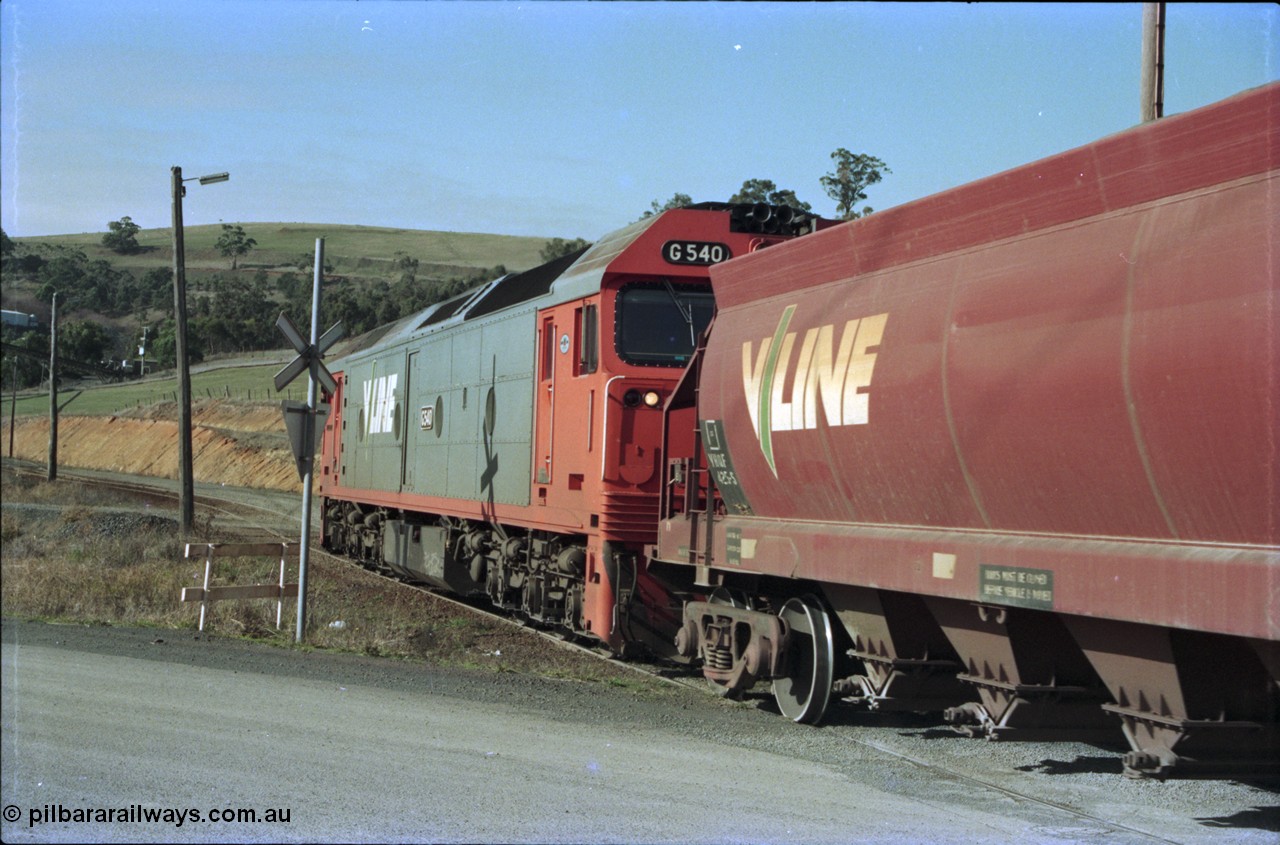 135-15
Kilmore East Apex Quarry siding, trailing shot of V/Line broad gauge G class G 540 Clyde Engineering EMD model JT26C-2SS serial 89-1273 and VHQF class bogie hopper waggon VHQF 425 arriving in the siding.
Keywords: G-class;G540;Clyde-Engineering-Somerton-Victoria;EMD;JT26C-2SS;89-1273;