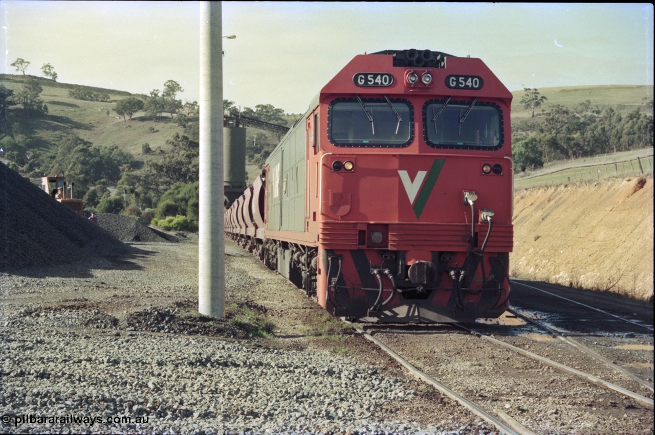 135-19
Kilmore East Apex Quarry siding, V/Line broad gauge G class G 540 Clyde Engineering EMD model JT26C-2SS serial 89-1273 on the front of the stone train as it is loaded by the front-end wheel loader.
Keywords: G-class;G540;Clyde-Engineering-Somerton-Victoria;EMD;JT26C-2SS;89-1273;