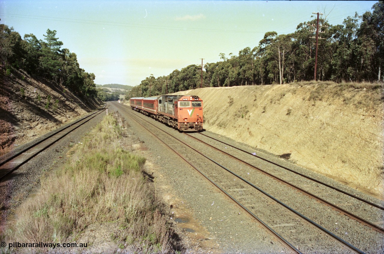 135-22
Heathcote Junction looking south, V/Line's last member of the broad gauge N class N 475 'City of Moe' Clyde Engineering EMD model JT22HC-2 serial 87-1204 with N set, down pass, standard gauge line on the far left.
Keywords: N-class;N475;Clyde-Engineering-Somerton-Victoria;EMD;JT22HC-2;87-1204;