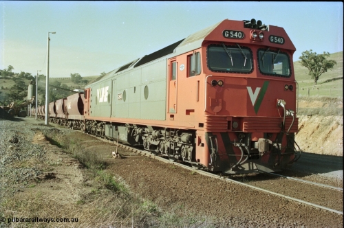 135-21
Kilmore East Apex Quarry siding, V/Line broad gauge G class G 540 Clyde Engineering EMD model JT26C-2SS serial 89-1273 on the front of the stone train as it is loaded by the front-end wheel loader.
Keywords: G-class;G540;Clyde-Engineering-Somerton-Victoria;EMD;JT26C-2SS;89-1273;