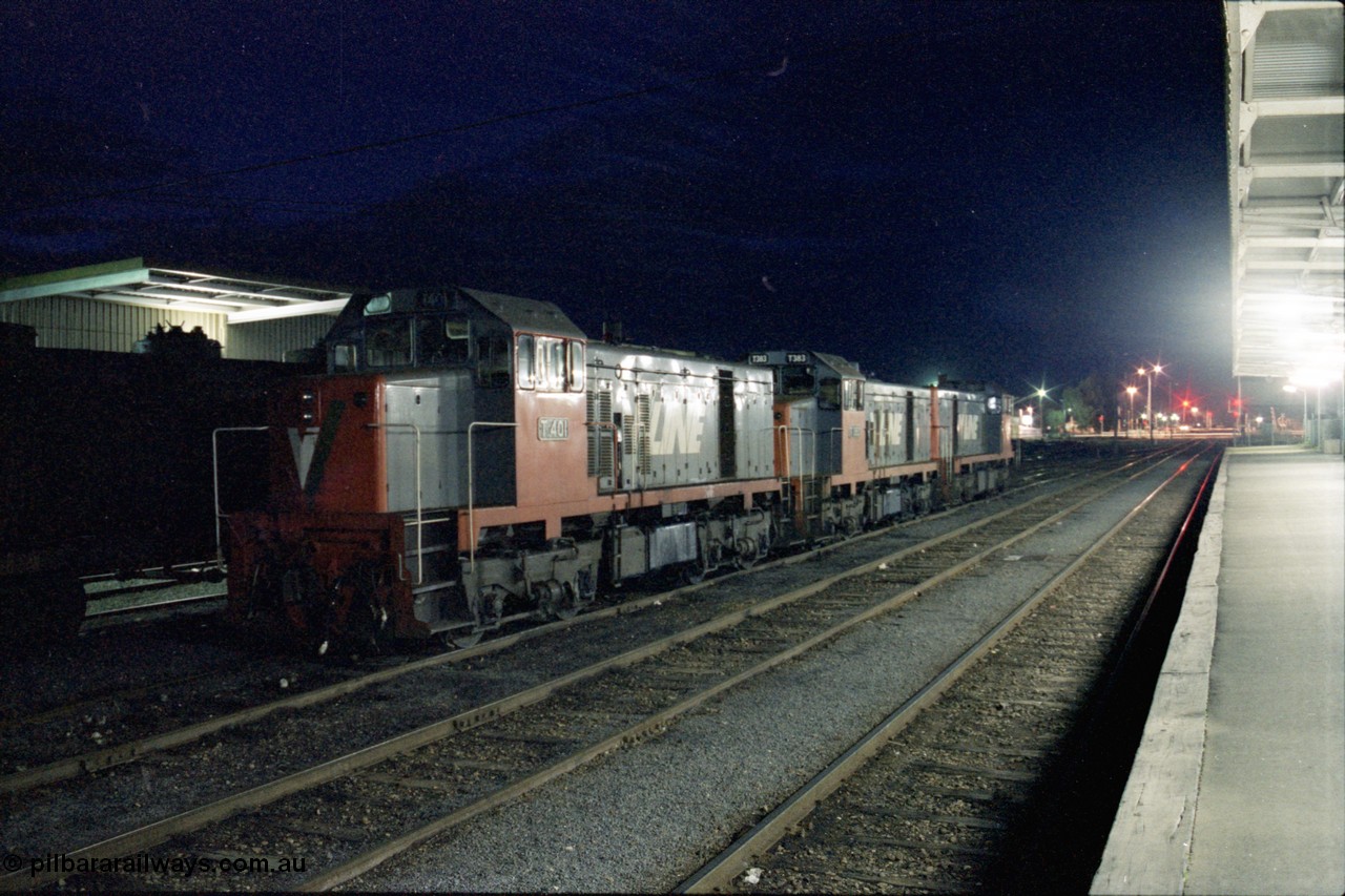 136-25
Shepparton station platform view looking north, night shot of three broad gauge V/Line T class locos, T 401 Clyde Engineering EMD model G18B serial 67-496, T 383 Clyde Engineering EMD model G8B serial 64-338 and sister T 382 serial 64-337.
Keywords: T-class;T401;Clyde-Engineering-Granville-NSW;EMD;G18B;67-496;