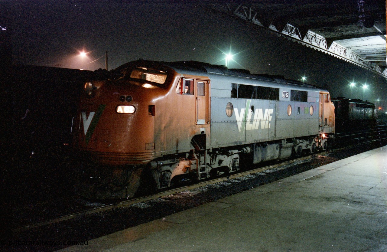 136-30
Seymour station platform view V/Line broad gauge A class A 62 Clyde Engineering EMD model AAT22C-2R serial 84-1183 rebuilt from B 62 Clyde Engineering EMD model ML2 serial ML2-3 waits in the rain to run the Sunday evening down Cobram pass 8345.
Keywords: A-class;A62;Clyde-Engineering-Rosewater-SA;EMD;AAT22C-2R;84-1183;rebuild;bulldog;