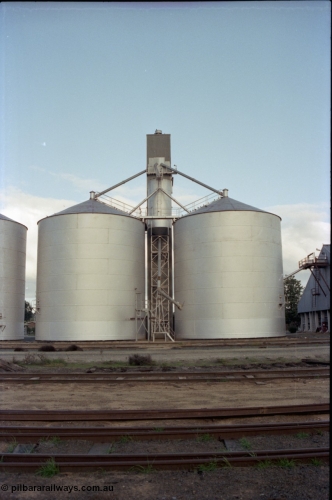 136-19
Deniliquin Ascom style silo complex, track view, loading spout and surge silo.
