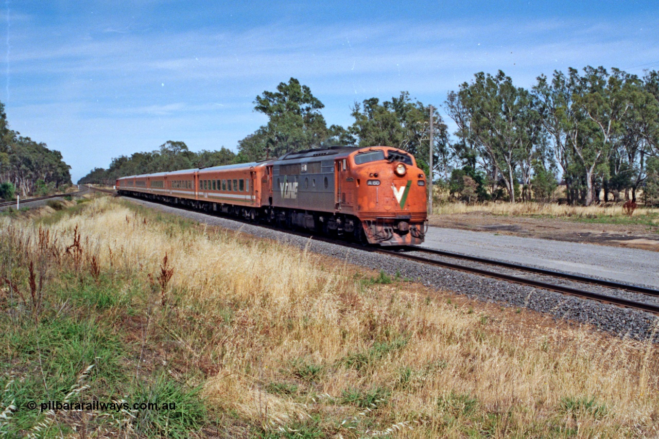 137-1-09
Euroa, down broad gauge Albury passenger train with V/Line A class A 60 'Sir Harold Clapp' Clyde Engineering EMD model AAT22C-2R serial 84-1184 rebuilt from B 60 'Sir Harold Clapp' Clyde Engineering EMD model ML2 serial ML2-1 and double N set, standard gauge line is at extreme left.
Keywords: A-class;A60;Clyde-Engineering-Rosewater-SA;EMD;AAT22C-2R;84-1184;rebuild;bulldog;
