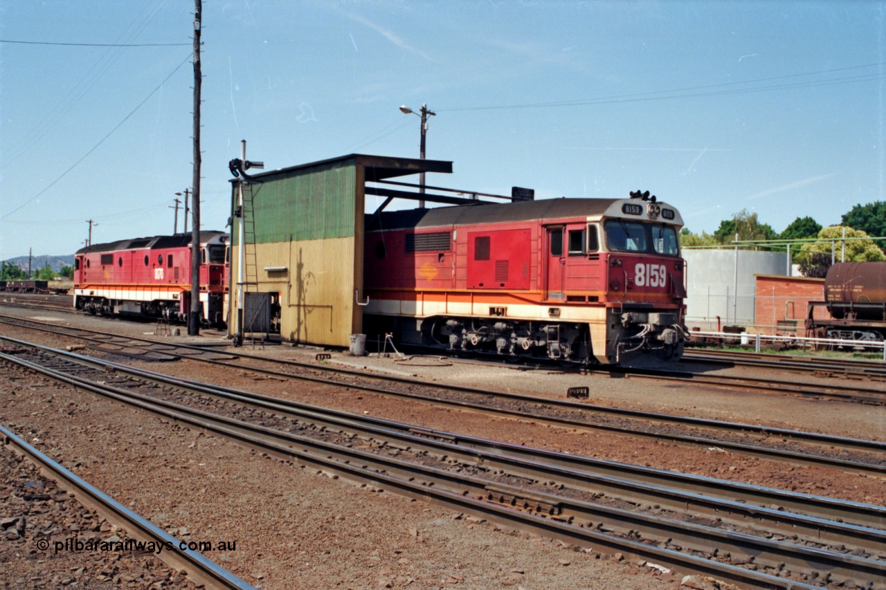 137-1-23
Albury loco depot fuel point, standard gauge NSWSRA 81 class locos 8159 Clyde Engineering EMD model JT26C-2SS serial 84-1078 and 8170 serial 85-1089 receive attention.
Keywords: 81-class;8159;Clyde-Engineering-Kelso-NSW;EMD;JT26C-2SS;84-1078;