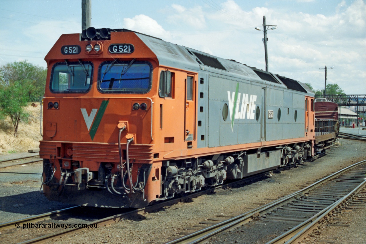 137-1-25
Albury loco depot, V/Line standard gauge loco G class G 521 Clyde Engineering EMD model JT26C-2SS serial 85-1234 rests between jobs, the road to the turntable is to the left of the loco, behind it is a NSW shunters float and guards van.
Keywords: G-class;G521;Clyde-Engineering-Rosewater-SA;EMD;JT26C-2SS;85-1234;