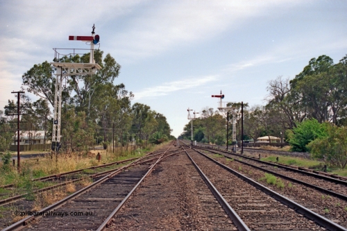 137-1-10
Euroa station yard overview looking north, down home lattice semaphore signal posts 4 and 5 with up home post 6 in the background, Road No.4 joining No.3 on the left, with double compound points to No.2 Rd (mainline), with No.1 Rd on the right with point rodding along side it, the standard gauge line on the far right.
