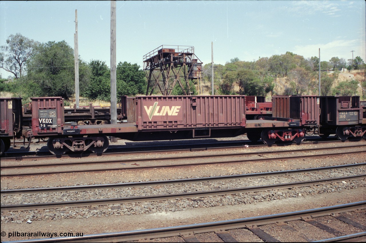 137-2-01
Albury south yard, V/Line broad gauge VKOX type bogie slab steel waggon VKOX 7, runs between Albury and Long Island steel mill. The slabs are trans-shipped here in Albury from standard gauge trains to broad gauge trains. This traffic eventually went to standard gauge all the way to Melbourne, it is now trans-shipped there.
Keywords: VKOX-type;VKOX7;